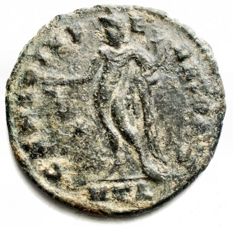 reverse: Impero Romano - Galerius. 305-311.  follis (25,05 mm, 6,26 g) Zecca Heraclea 310. d/ IMP C GAL VAL MAXIMINO P F INV AVG Testa laureata a ds r / GENIO IMPERATORIS Genio stante volto a sn con patera e cornucopia; */HTA in ex. BB++/BB. Patina verde