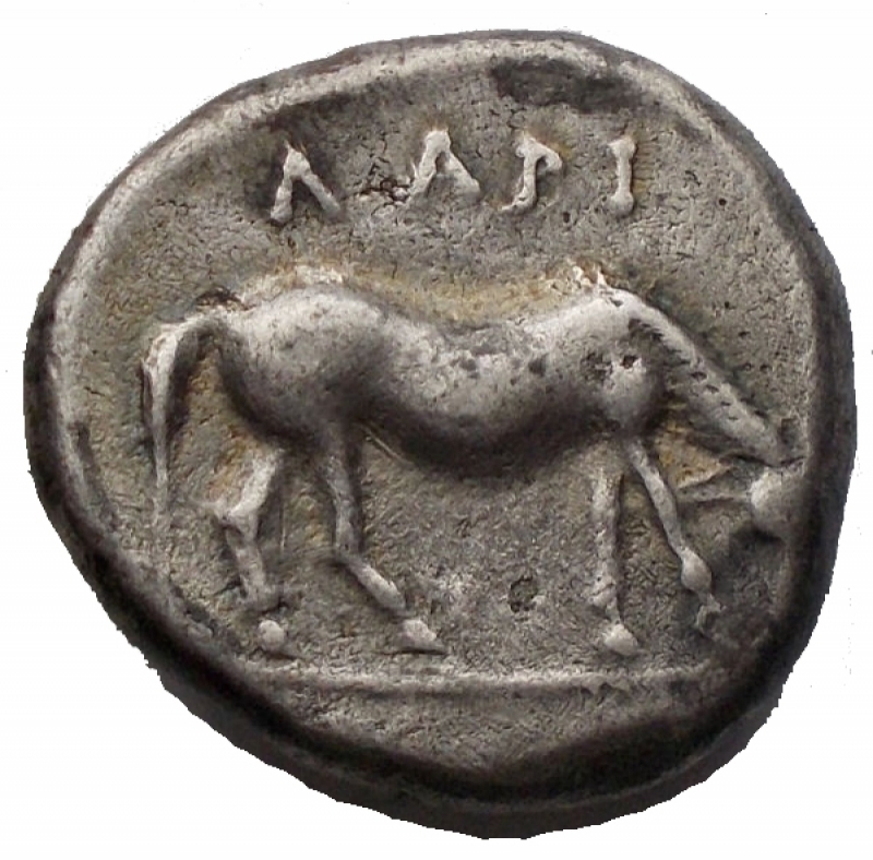 reverse: Modo Greco - THESSALIA, Larissa. Drachm. 400-380 BC A / Head of the nymph Larissa slightly to the right R / Horse grazing to the right, on the legend AAPI. Ar. 6.05g. VF +. Patina. Very rare