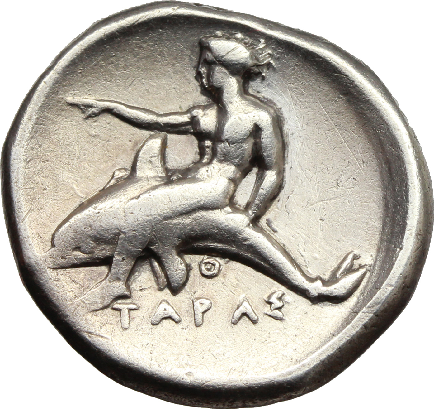 Древняя монета с дельфином