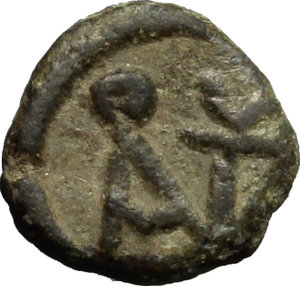 reverse: Anastasius I (491-518).  AE Nummus, Constantinople mint, struck 491-498 AD. Obv. Bust right. Rev. Monogram of Anastasius. D.O. 15. Sear 13. AE. g. 0.48  mm. 7.50  R. Rare. Earthen olive-green patina. About VF/VF. 