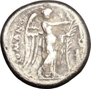 reverse: Anonymous.  AR Didrachm, c. 265-242 BC, Neapolis mint. Obv. Head of Roma right, wearing Phrygian helmet; behind, cornucopiae. Rev. ROMANO. Victory standing right, attaching wreath to palm-branch; in right field, uncertain Greek letter. Cr. 22/1. HN Italy 295. AR. g. 6.33  mm. 19.00  RR. Very rare. Old cabinet tone with iridescent hues. VF.