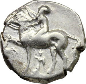 obverse: Italy. Southern Apulia, Tarentum.   AR Nomos, c. 380-340 BC. Obv. Nude youth on horseback left, placing wreath on horse s head;  below horse, palladium. Rev. TAPAΣ. Taras astride dolphin left, holding kantharos (?) in extended right hand; below dolphin, P. HN Italy 875. SNG Fitzwilliam 258. Vlasto 425. SNG ANS 918. AR. g. 7.79  mm. 20.90   Scratch on rev.  VF.