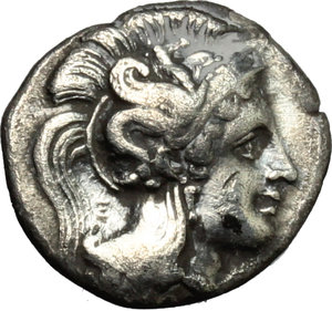 obverse: Italy. Southern Apulia, Tarentum.   AR Diobol, 380-325 BC. Obv. Head of Athena right, wearing Crested Attic helmet decorated with hippocamp. Rev. Herakles standing right, strangling lion with both hands; at left club, between Herakles  leg, K; TA to upper right. HN Italy 914. AR. g. 1.16  mm. 13.00   Good metal. Brilliant and lightly toned, with golden hues. Good VF.