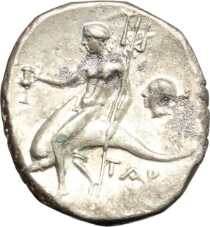 reverse: Italy. Southern Apulia, Tarentum.   AR Nomos, c. 272-240 BC. Obv. Warrior on horseback right, holding shield and two spears, preparing to cast a third; ΔI behind, API-ΣTO/KΛ-HΣ in two lines below. Rev. Phalantos astride, dolphin left, holding kantharos and trident; to right, head of nymph left; below, TAP[AΣ]. HN Italy 1033. Vlasto 877. AR. g. 6.26  mm. 20.50   Enchanting old cabinet tone, with golden and iridescent hues. A few uncleaned, almost invisible, deposits, otherwise EF.