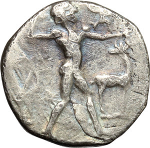 obverse: Italy. Bruttium, Kaulonia.   AR Stater, c. 475-425 BC. Obv. Apollo advancing right, holding branch; small daimon running on Apollo s left arm; to right, stag standing right, head reverted. Rev. Stag standing right. HN Italy 2044. Cf. Noe E. 62-77. AR. g. 7.65  mm. 20.00   Toned. Hair-line flan crack at five o clock, otherwise about VF/VF.
