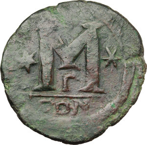 reverse: Anastasius I (491-518).  AE Follis, Constantinople mint. Obv. D N ANASTASIVS PP AVG. Diademed, draped and cuirassed bust right. Rev. Large M between two stars; above, cross; beneath Γ; in exergue, CON. D.O. 23. M.I.B. 27. AE. g. 17.30  mm. 36.00    About VF/VF.