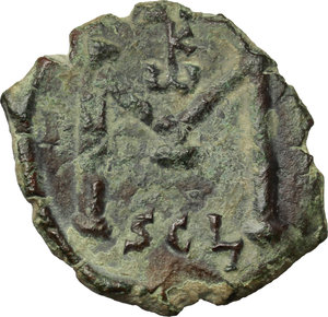 reverse: Constans II (641-668).  AE Follis, Syracuse mint. Obv. Bust facing, with long beard, wearing crown and chlamys, and holding globus cruciger. Rev. Large M; above, monogram 35; beneath, SCL. DOC 178. MIB 207. Sear 1107. AE. g. 4.74  mm. 24.00   Traces of over-striking. In excellent condition for the issue. Green-brown patina. About EF.