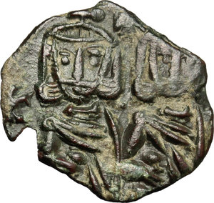 obverse: Constantine V Copronymus with Leo IV (751-775).  AE Follis, Syracuse mint. Obv. Constantine V and Leo IV standing facing, each wearing crown and chlamys and holding akakia; between their heads, cross. Rev. Leo III bearded, standing facing, wearing crown and chlamys and holding cross potent; [to left, Λ/Ε/Ο]; to right, Δ/Ε/C. DOC 19. Sear 1569. AE. g. 1.97  mm. 18.50    Good VF.