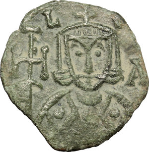 obverse: Nicephorus I with Stauracius (803-811).  AE Follis, Syracuse mint. Obv. Bust of Nicephorus facing, with short beard, wearing crown and loros, and holding cross potent; to left, N; to right, I/K/H. Rev. Facing bust of Stauracius, beardless, wearing crown and chlamys and holding globus cruciger; to left, C; to right, T/A/V. DOC 10. Sear 1612. AE. g. 2.49  mm. 19.00    Good VF.