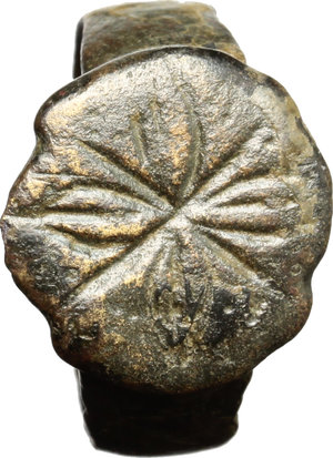 obverse: Bronze ring, the bezel decorated with floral pattern.  Medieval, 10th-14th century.  Size 15 mm