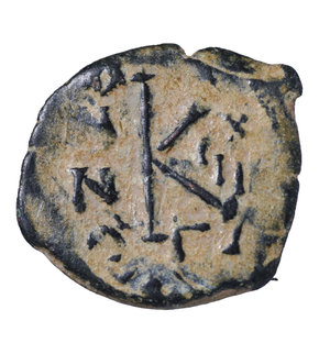 reverse: JUSTIN II. 565-578 AD. AE HALF FOLLIS. 20 NUMMI. Mint Constantinople. 568 AD. 2,55 gr. - 18,40 mm. O:\ Justin on left and Sophia on right seated facing on double throne, both nimbate; they hold between them globe surmounted by large cross, and each holds long sceptre. R:\ Large K; above cross, to left ANNO; to right III (year 3), beneath Γ. BMC 82-100. VF for this issue