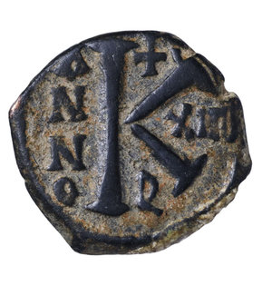 reverse: MAURICE TIBERIUS. 582-602 AD. AE HALF FOLLIS. 20 NUMMI. Mint of Theoupolis. 594 AD. 5,95 gr. - 19,40 mm. O:\ Bust facing, wearing crown with trefoil ornament, and consular robes; in right hand, mappa; in left eagle.tipped sceptre. R:\ Large K; above cross ; to left ANNO; to right XII. BMC 199-207, MIB 99A. XF