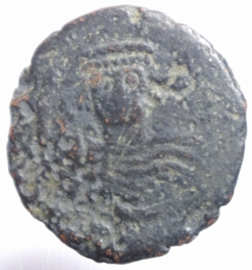 obverse: Impero Bizantino.Giustiniano I (527-565) Folllis .Nicomedia D\D N IVSTINI  ANVS P P AVG, busto frontale, elmato e corazzato, scudo decorato e globo crucigero nella d. alzata, Rv. A/N/N/O -III, grande M; sopra croce, sotto B. In ex. NIKO. DOC 115-139; MBC 186-220.MB.