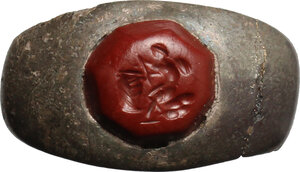 obverse: Silve ring with red jasper stone engraved with picture of Amor.  Roman period, 2nd-4th century.  Size 20 mm