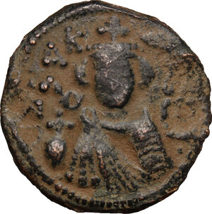 obverse: Arab-byzantine, Umayyad Caliphate, pre-reform coinage.. AE Fals, Emesa mint, 41-77 H / 661-697 AD