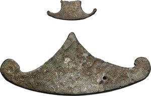 reverse: Varia romana.. Two bronze decorations, pelta shaped, 3rd century AD