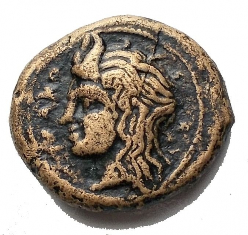 obverse: Mondo Greco - Syracuse. Timoleon and the Third Democracy, 344-317 BC. Hemilitron (Bronze, 14 ,7 x 13mm, 2.7 g ). PA- Head of Pan to left. Rev. Syrinx with nine pipes within oak wreath. CNS II 94. SNG ANS 490-491. Very rare