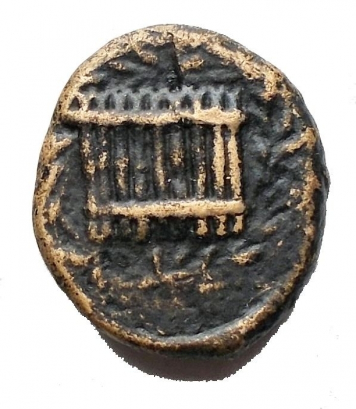 reverse: Mondo Greco - Syracuse. Timoleon and the Third Democracy, 344-317 BC. Hemilitron (Bronze, 14 ,7 x 13mm, 2.7 g ). PA- Head of Pan to left. Rev. Syrinx with nine pipes within oak wreath. CNS II 94. SNG ANS 490-491. Very rare