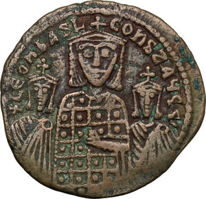 obverse: Basil I the Macedonian, with Constantine and Leo VI (867-886).. AE Follis. Constantinople mint. Struck 870-879
