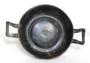 reverse: Greek black-glazed kylix.  4th century BC.  23.5 cm diameter (including handles)