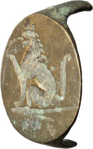 reverse: Bronze bezel of a ring with engraved seated lion.  Medieval period.  Bronze. 19 x 16 mm