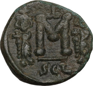 reverse: Constantine IV Pogonatus, with Heraclius and Tiberius (668-685).. AE Follis. Syracuse mint. Struck 672-677