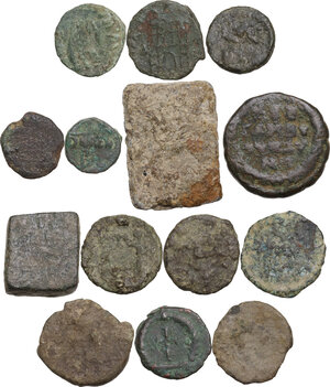 reverse: The Roman and Byzantine Empire.. Multiple lot of twelve (12) unclassified late Roman AE denominations and two (2) Byzantine AE  commercial weights.   [14 in total]