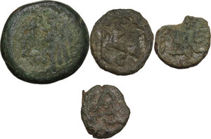reverse: Ostrogothic Italy.. Multiple lot of four (4) AE coins: Theoderic, 5 Nummi, Metlich 81, Athalaric, 2.5 Nummi, Metlich 88, Baduila 2,5 Nummi, Metlich 94 (2 examples)