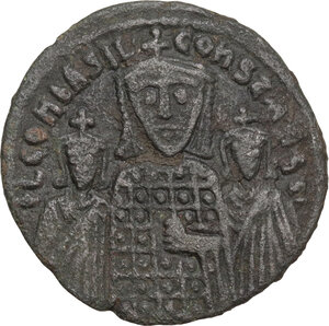 obverse: Basil I the Macedonian, with Constantine and Leo VI (867-886).. AE Follis. Constantinople mint, 870-879