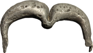 obverse: Silver brooch in the shape of a double arch.  Greek, 3rd  century BC  Pin missing.  40 mm. 15.40 g