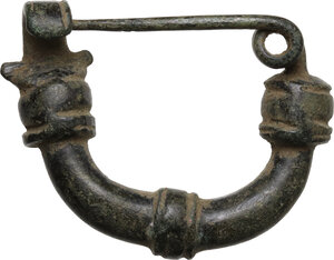 reverse: Bronze fibula.  Roman period, 1st - 2nd century AD.  38 x 30 mm