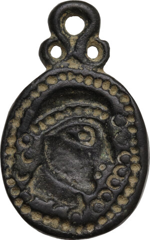 obverse: Bronze applique with face.  Migration period, 5th-7th century AD.  32 x 20 mm