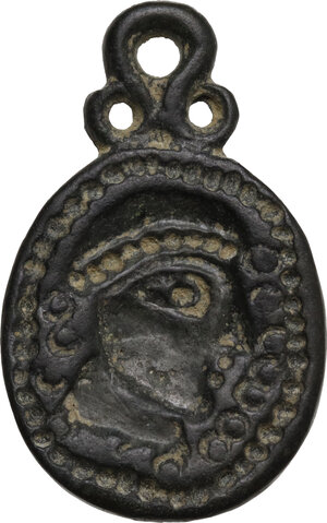reverse: Bronze applique with face.  Migration period, 5th-7th century AD.  32 x 20 mm