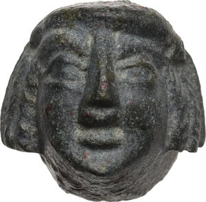 obverse: Bronze theater actor s head, possibily a game token.  Greek Sicily, 4th-3rd century BC.  15x14,5 mm