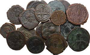 obverse: The Byzantine Empire. Lot of 17 unclassified AE denominations, including: Justin, Justinian I, Maurice Tiberius, Phocas and Anonymous Folles