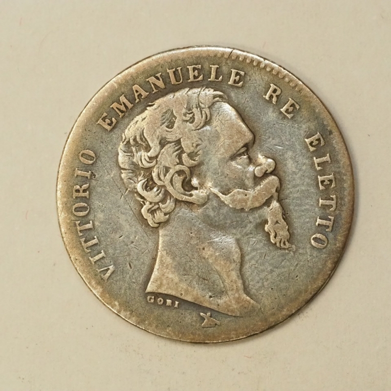 obverse: PREUNITARIE - VITT.EM.II - RE ELETTO - 1859/1861 - 1 lira argento 1860 Firenze ( senza scettro ) correlato da cartellino e bustina artigianali anni  60