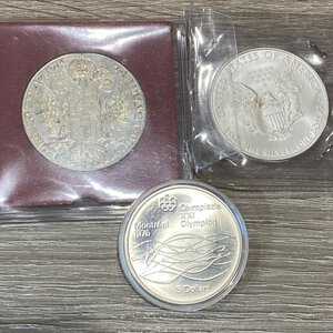 obverse: ESTERE. Lotto di 3 monete grande modulo in argento (tallero Maria Teresa, Oncia Stati Uniti 2010, Canada 5 dollari 1975). FDC 
