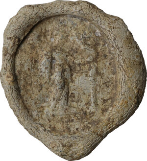 obverse: Lead seal with standing figure holding shield.  Roman period