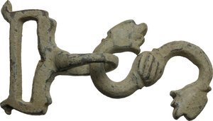 obverse: Bronze part of a bridle fastening with floral embellishment.Medieval.53x30 mm