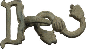 reverse: Bronze part of a bridle fastening with floral embellishment.Medieval.53x30 mm