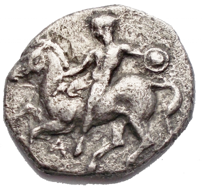 obverse: Greek coins Calabria. Tarentum. Nomos. ca. 344-340 BC d / Naked warrior on horseback on the left, with a small round shield; A below. r / Taras astride a dolphin facing left. 6.99 g. 21.3 x 19.7 mm. aVF