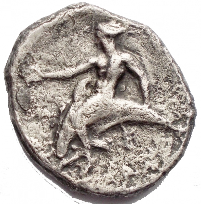 reverse: Greek coins Calabria. Tarentum. Nomos. ca. 344-340 BC d / Naked warrior on horseback on the left, with a small round shield; A below. r / Taras astride a dolphin facing left. 6.99 g. 21.3 x 19.7 mm. aVF