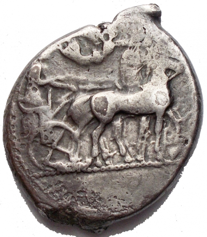 reverse: KATANE. Ca.445-435 B.C. Tetradrachm. Standing male charioteer in quadriga r., Nike above crowning horses. Rv. Laureate head of Apollo r. with short hair, ethnic. 16,81 grams. VF