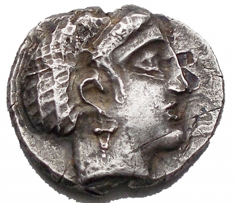 reverse: Greek ILLYRO-PAEONIAN REGION, Damastion (Dardania). Circa 340-330 BC. AR Drachm (14,9 x 13,5 mm. 2,79 g). Female head right, wearing stephanos, hair in sakkos / Portable ingot inscribed with swastika and pellet. Good VF. Good metal for issue. Toned. Rare