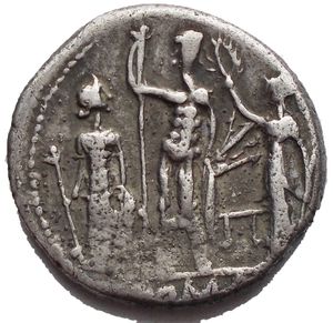 reverse: Cn. Blasio Cn. F. AR Denarius (18,68 mm. 3,81 g) 112/111 BC. Obv. Helmteted head of Mars right; behind, prow-stem; before, CN·BLASIO·CN·F.Rev. Iupiter standing facing between Juno and Minerva and holding sceptre in right hand and thunderbolt in left hand; Juno holds sceptre in right hand; Minerva holds sceptre in left hand and crowns Iupiter with right hand; in exergue, ROMA.Crawford 296/1d. VF
