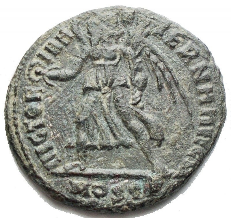 reverse: Roman Empire - Maxentius. 306-312 A.D. : Follis. D / IMP MAXENTIVS PF AVG Head of Maxentius to the right. R \ VICTORIA AETERNA AVG N Victory to the right with branch and patera. Ostia Mint. Ric. 54. Weight 5.75 gr. Diameter 18.7 mm. Green Patina