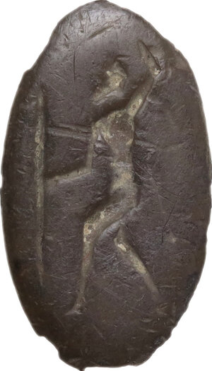 obverse: Bronze bezel engraved with hoplite.  Greek world, 2nd - 1st century BC.  18 mm