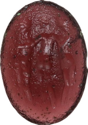 obverse: Dark-red glass paste decorated with the three Graces.  Roman period, 1st-3rd century AD.  13 mm