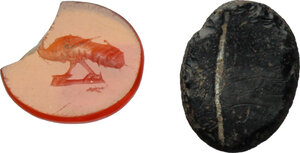 obverse: Lot of two (2) gems: orange carnelian intaglio with figure of peacock advancing left, dark vitreous paste intaglio.  Roman, 1st-3rd century AD.  8.5 x 7.5 mm., 9 x 7 mm