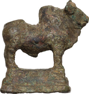 reverse: Solid bronze zebu figure standing on a shallow plinth.  Roman imperial, 1st-3rd century AD.  25 x 34 mm. 27.63 g